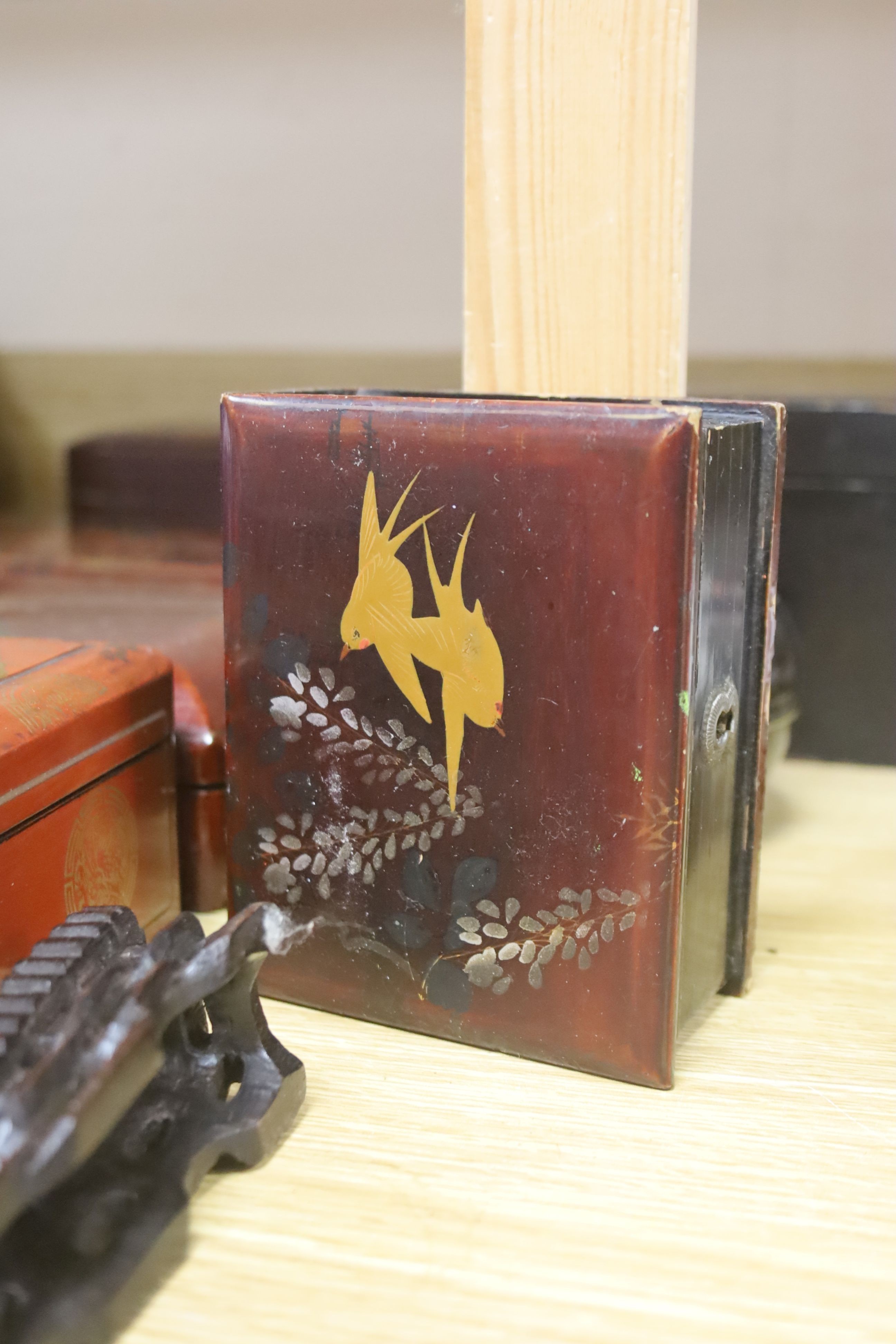 A group of Chinese or Japanese lacquer boxes and a wood stand